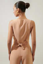 Women's peach button waistcoat with a structured silhouette.