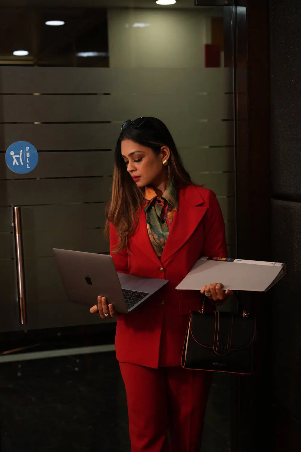 Bold red blazer suit set for corporate events.