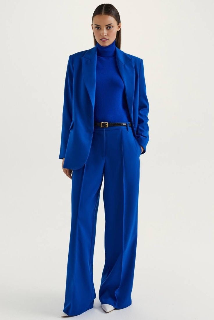 Blue blazer suit set paired with wide leg tailored pants.