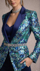 Blue floral sequin blazer with a matching top on a neutral background