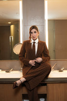 Brown Luxe Pinstripe Two-Piece Suit Set with Tie – lifestyle shot, seated | Beyond Formals