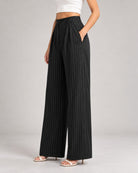 Black pinstripe wide-leg trousers, side view showing drape and side pocket | Beyond Formals