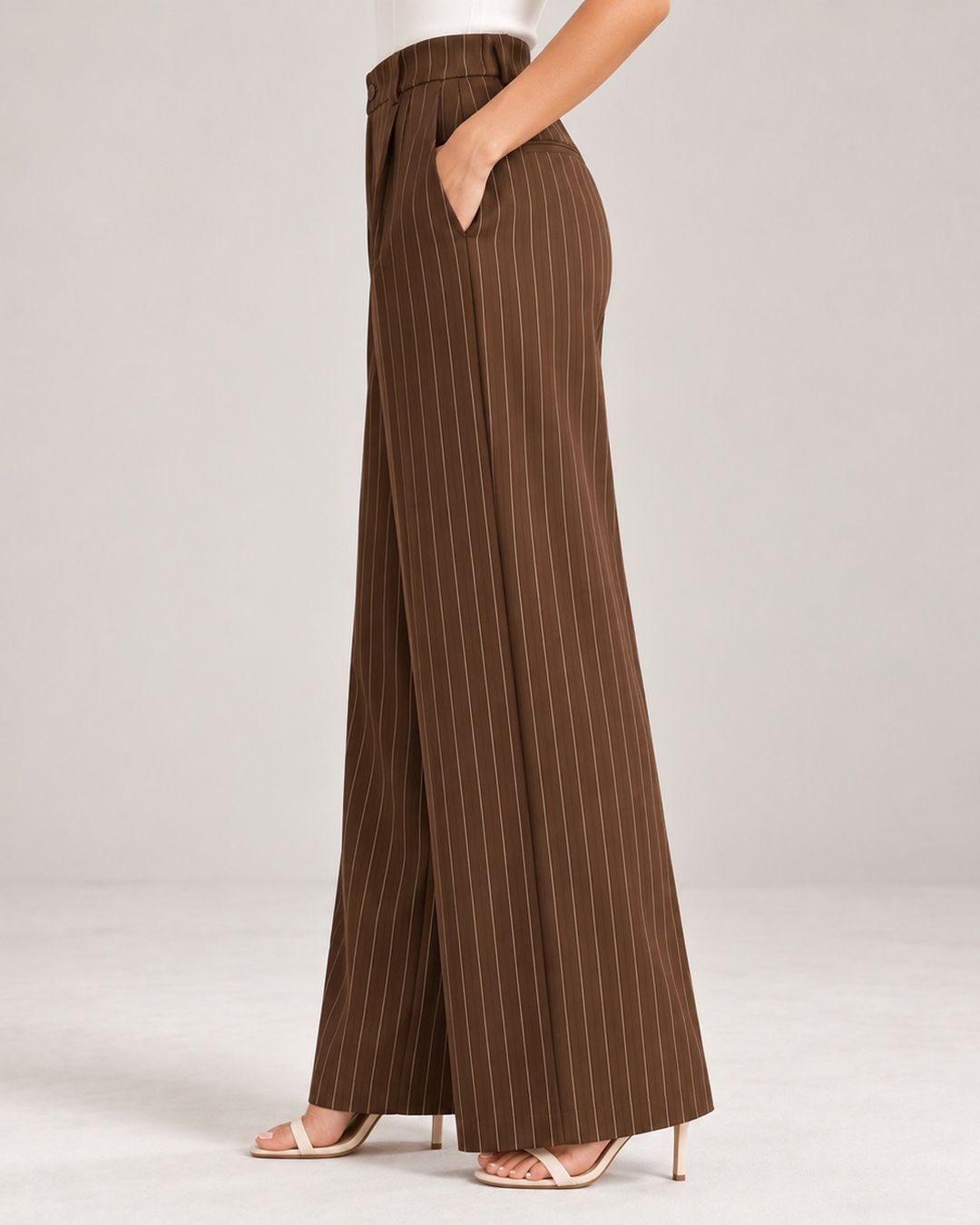 Brown pinstripe wide-leg trousers, side view showing drape and side pocket | Beyond Formals