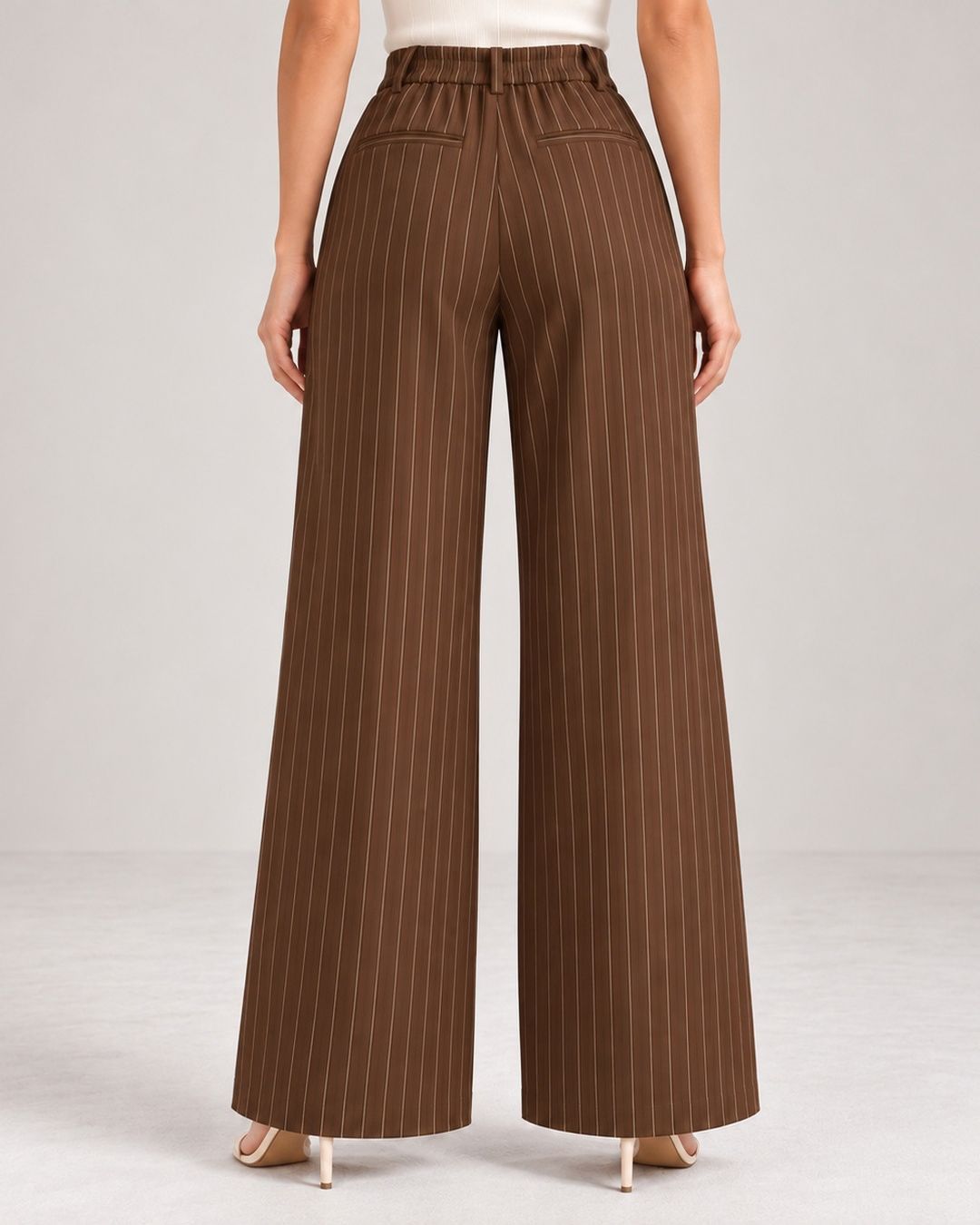 Back view of brown pinstripe wide-leg trousers showing elasticated waistband | Beyond Formals
