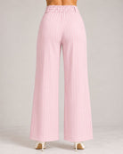 Back view of light pink pinstripe wide-leg trousers showing elasticated waistband | Beyond Formals