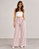 Light Pink pinstripe high-waist wide-leg trousers with white corset top, full-length front view | Beyond Formals